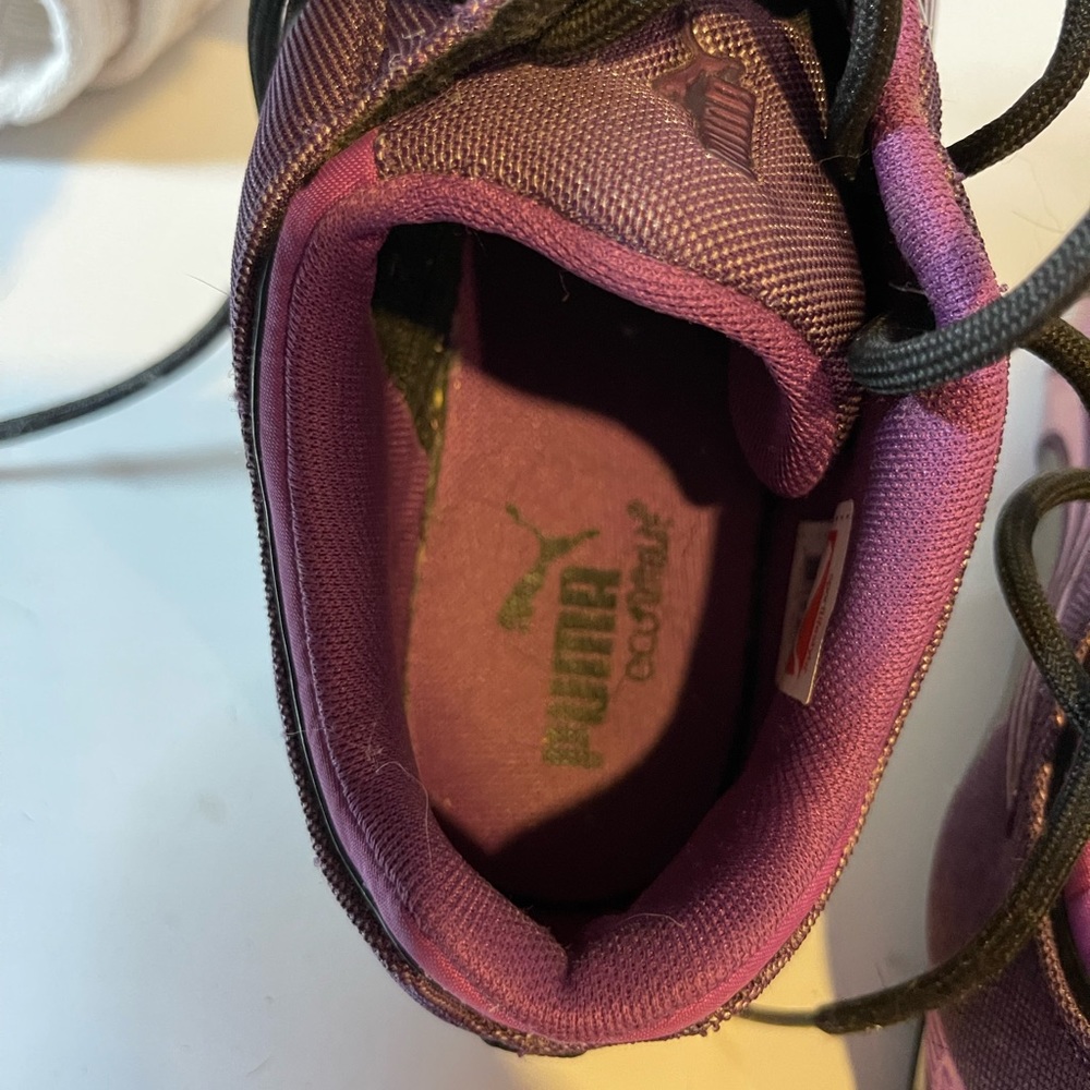 Women’s black and purple pumas size 9 .
